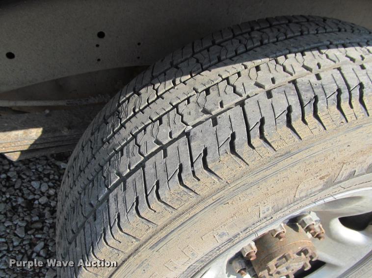 image for item J2597 2005 Dodge Ram 2500 Quad Cab flatbed pickup truck