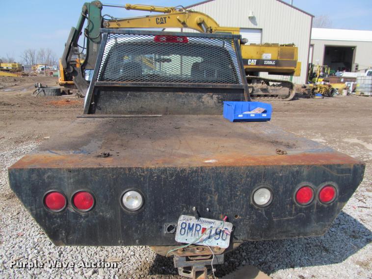 image for item J2597 2005 Dodge Ram 2500 Quad Cab flatbed pickup truck