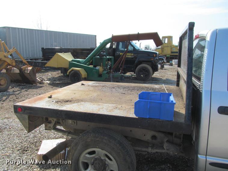 image for item J2597 2005 Dodge Ram 2500 Quad Cab flatbed pickup truck