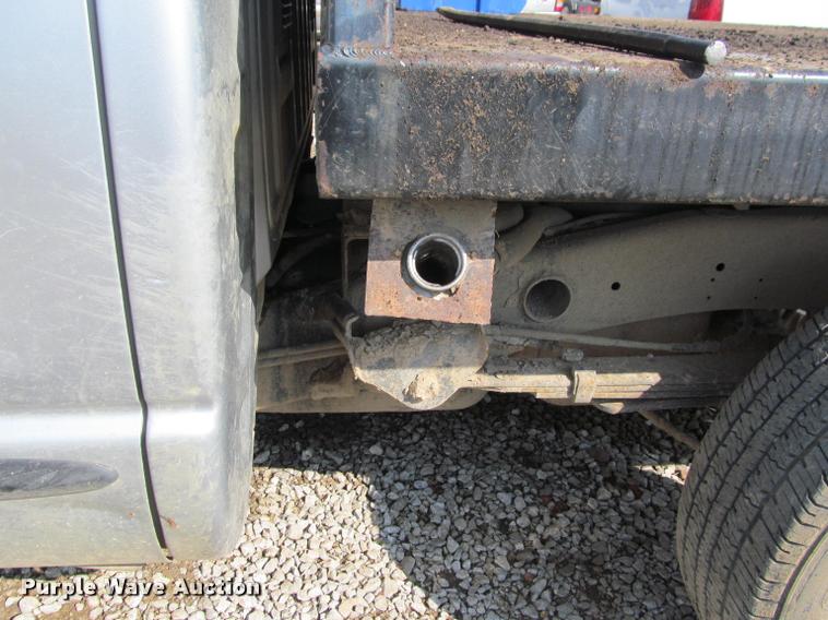 image for item J2597 2005 Dodge Ram 2500 Quad Cab flatbed pickup truck