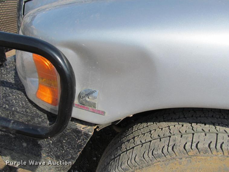 image for item J2597 2005 Dodge Ram 2500 Quad Cab flatbed pickup truck