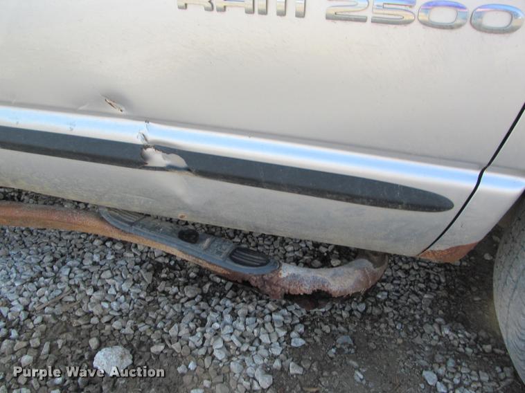 image for item J2597 2005 Dodge Ram 2500 Quad Cab flatbed pickup truck