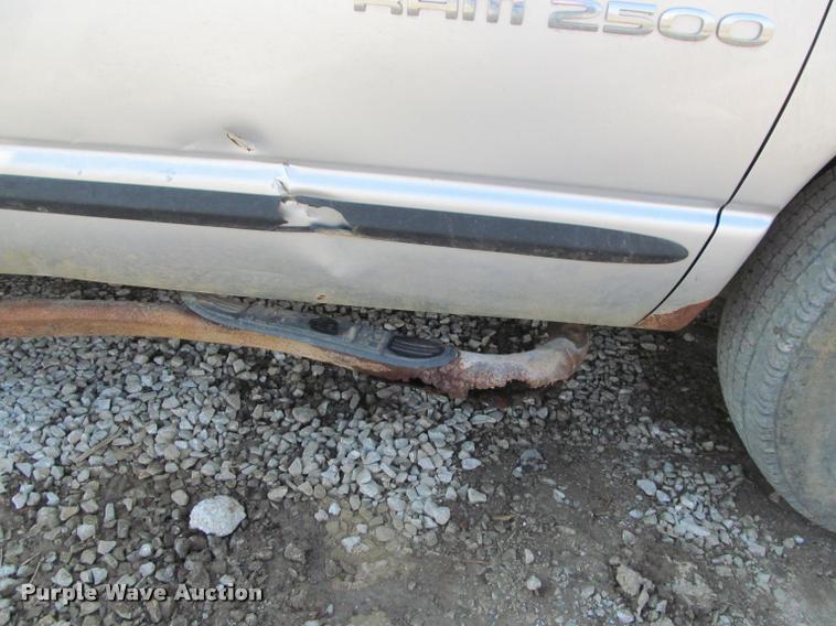 image for item J2597 2005 Dodge Ram 2500 Quad Cab flatbed pickup truck