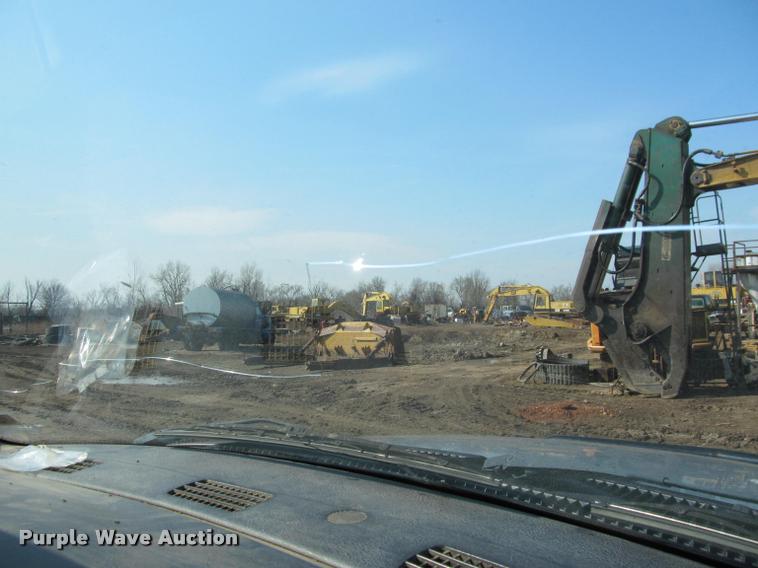 image for item J2597 2005 Dodge Ram 2500 Quad Cab flatbed pickup truck