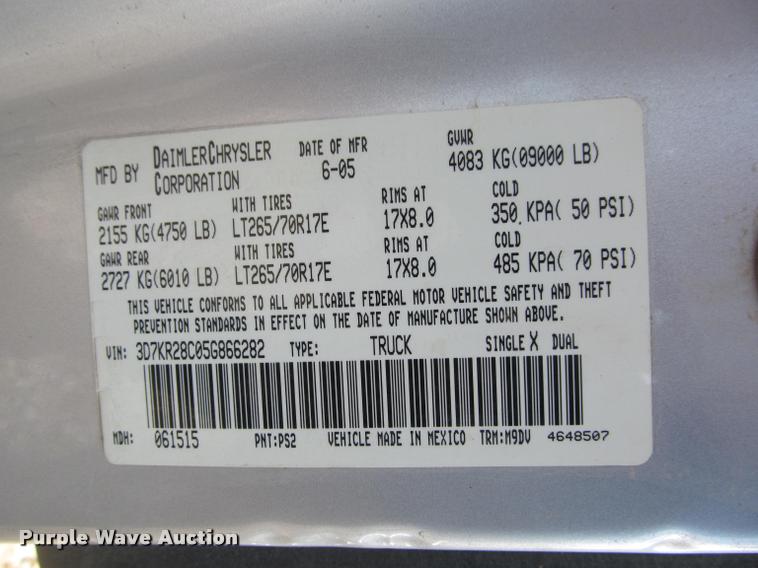 image for item J2597 2005 Dodge Ram 2500 Quad Cab flatbed pickup truck