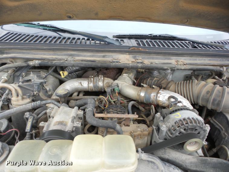 image for item J8655 2000 Ford F350 Super Duty SuperCab flatbed pickup truck