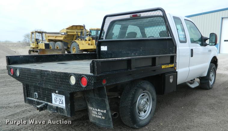 image for item K2681 2005 Ford F250 Super Duty SuperCab flatbed pickup truck