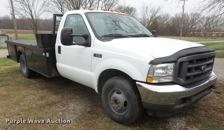 image for item DB0603 2004 Ford F350 Super Duty flatbed pickup truck