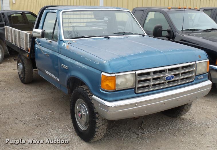 image for item DD9306 1988 Ford F250 HD flatbed pickup truck