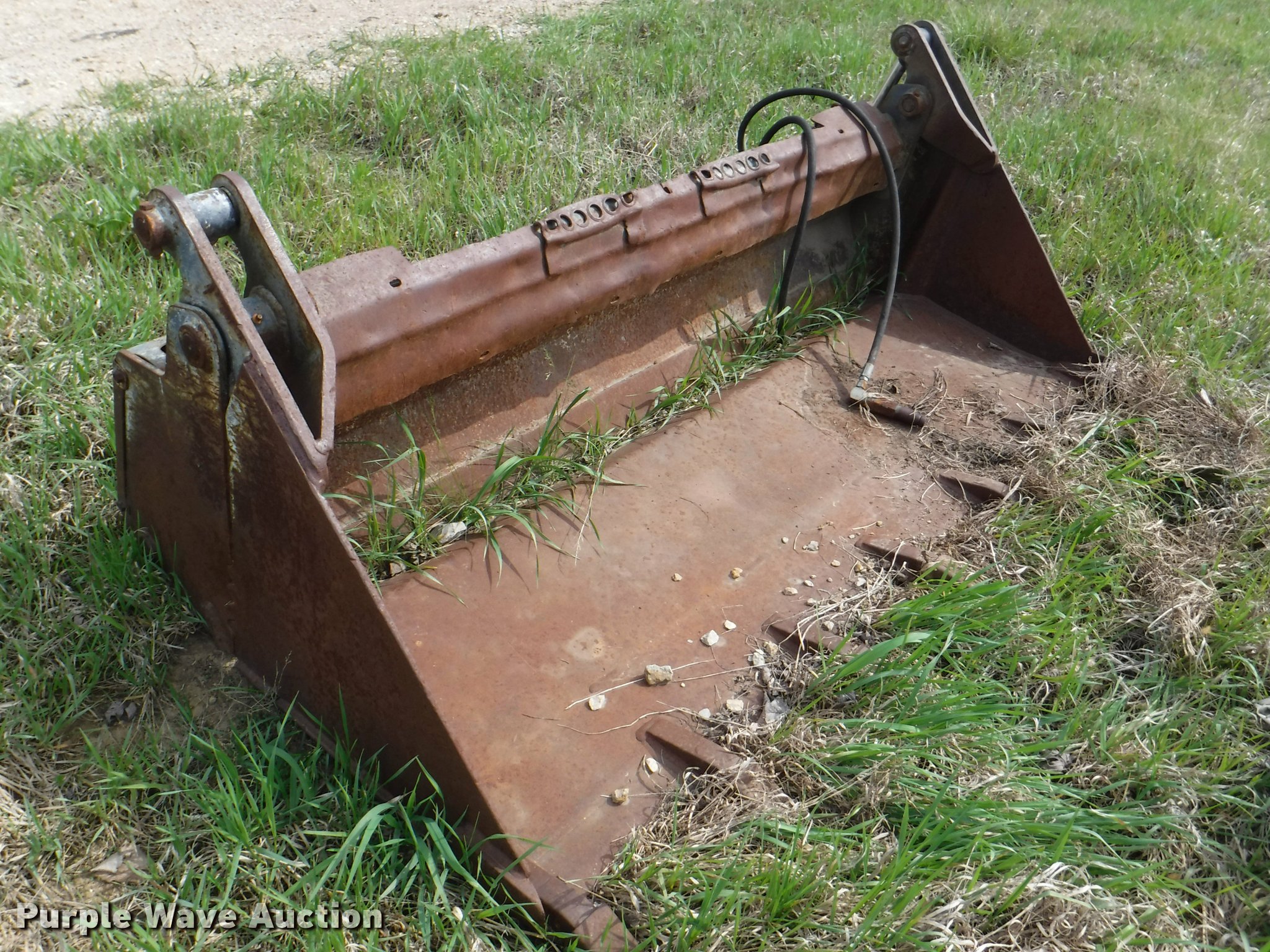 Four in one skid steer bucket in Lawrence, KS Item BY9182 sold Purple Wave