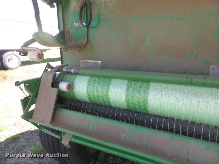 image for item F1996 2010 John Deere 568 Mega Wide Plus round baler