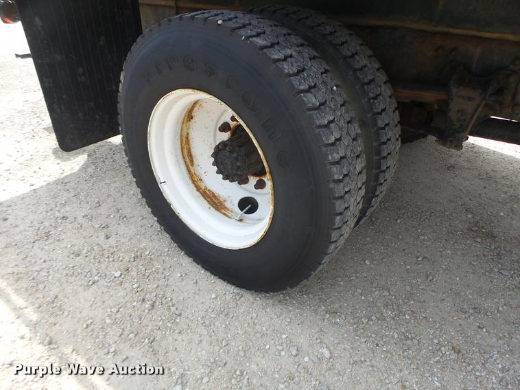 image for item DA3462 1999 Freightliner FL60 flatbed truck