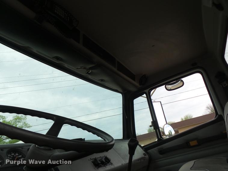 image for item DA3462 1999 Freightliner FL60 flatbed truck