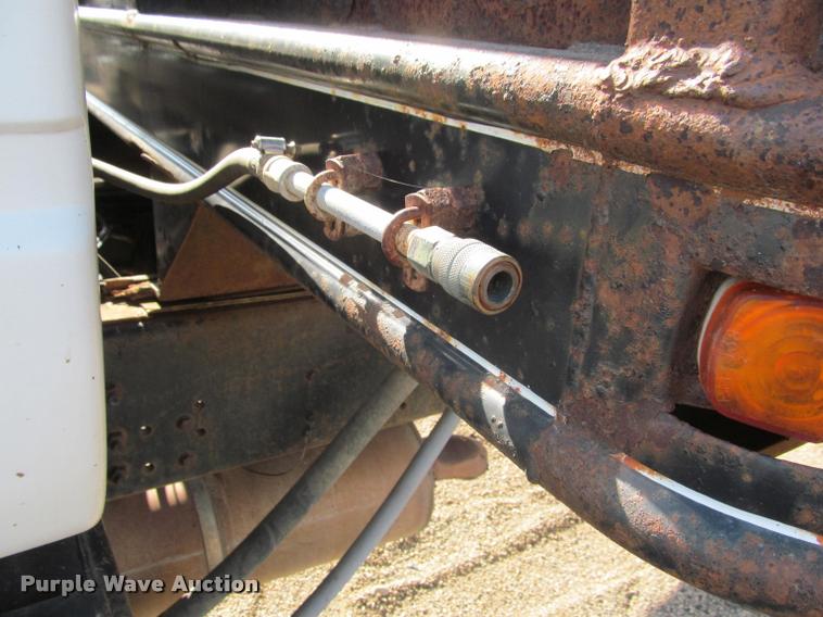 image for item K3988 1995 GMC TopKick TC7H064 flatbed truck with crane