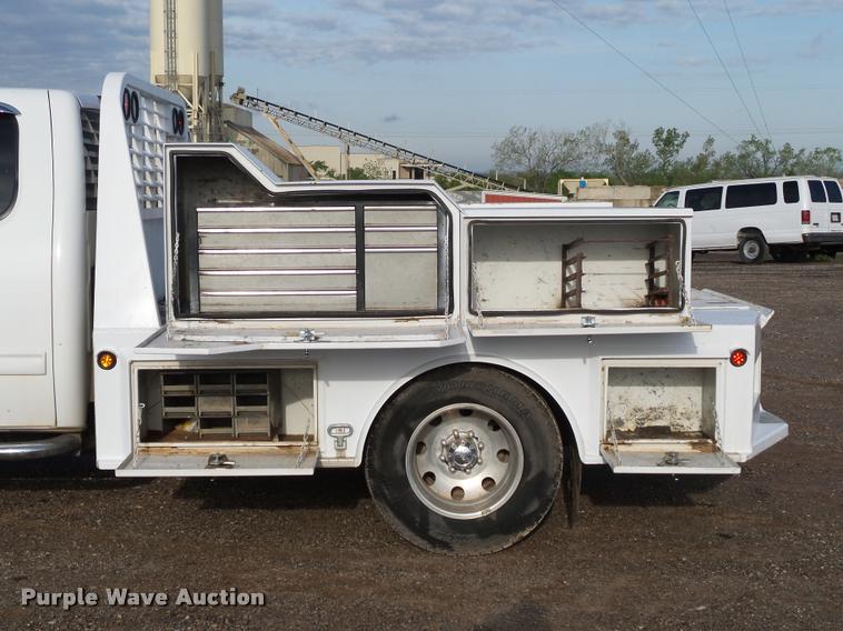 image for item DB0211 2009 Chevrolet Silverado 3500HD LT Ext. Cab flatbed pickup truck