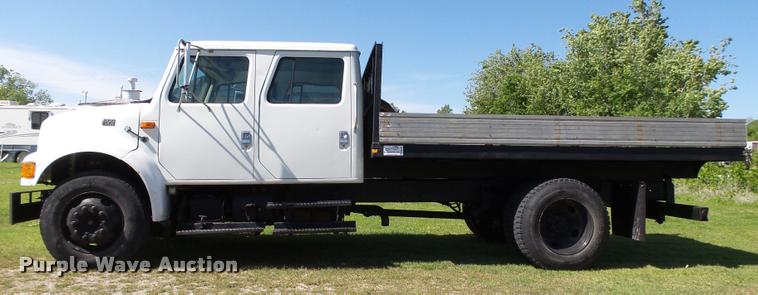 image for item DB4718 1999 International 4700 Crew Cab dump flatbed truck