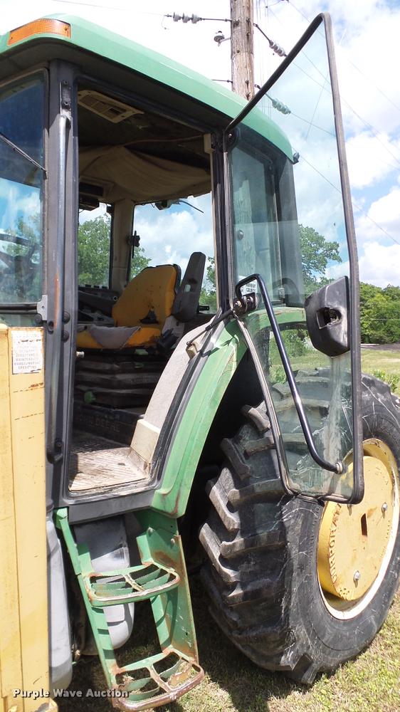 image for item DA6121 1998 John Deere 6310 tractor