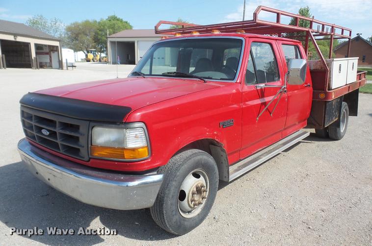 image for item DA6312 1997 Ford F350 Crew Cab flatbed pickup truck