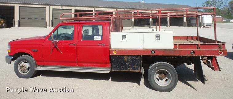 image for item DA6312 1997 Ford F350 Crew Cab flatbed pickup truck