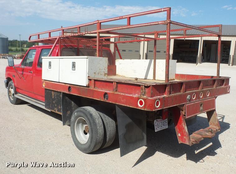 image for item DA6312 1997 Ford F350 Crew Cab flatbed pickup truck