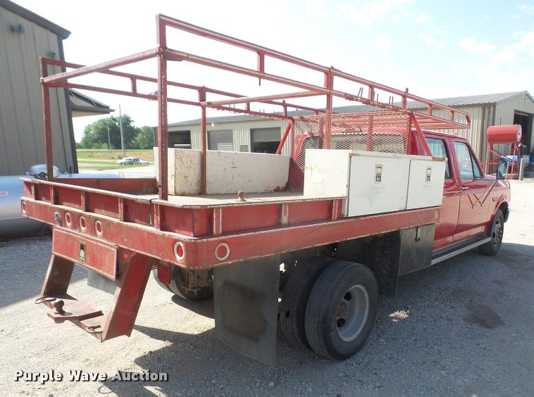 image for item DA6312 1997 Ford F350 Crew Cab flatbed pickup truck