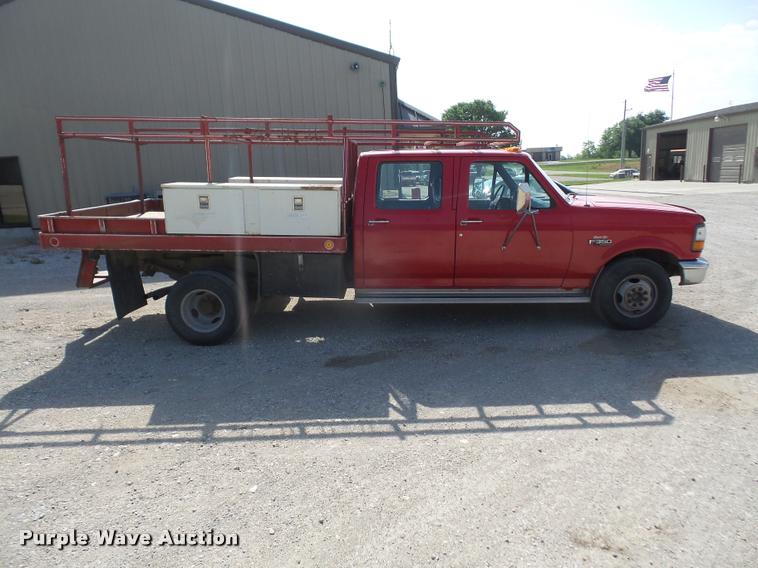 image for item DA6312 1997 Ford F350 Crew Cab flatbed pickup truck
