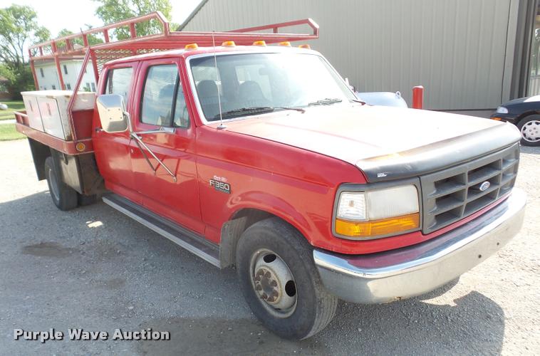 image for item DA6312 1997 Ford F350 Crew Cab flatbed pickup truck