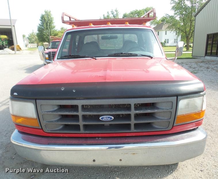 image for item DA6312 1997 Ford F350 Crew Cab flatbed pickup truck