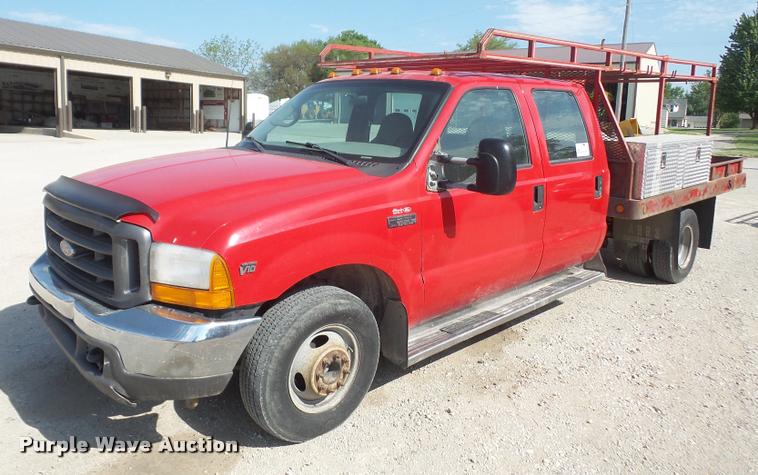 image for item DA6313 1999 Ford F350 Super Duty Crew Cab flatbed pickup truck