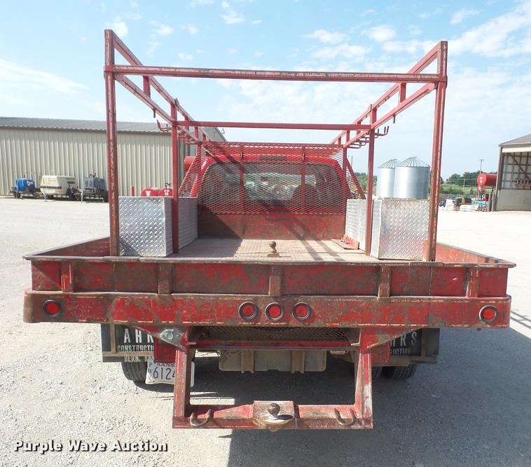 image for item DA6313 1999 Ford F350 Super Duty Crew Cab flatbed pickup truck