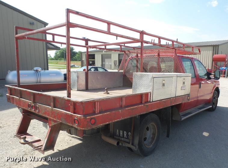 image for item DA6313 1999 Ford F350 Super Duty Crew Cab flatbed pickup truck