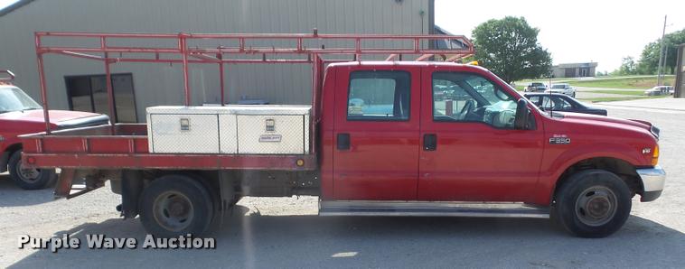 image for item DA6313 1999 Ford F350 Super Duty Crew Cab flatbed pickup truck
