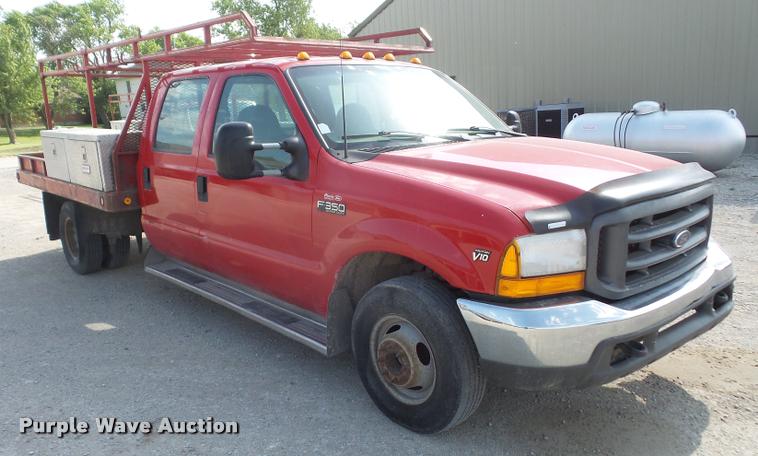 image for item DA6313 1999 Ford F350 Super Duty Crew Cab flatbed pickup truck