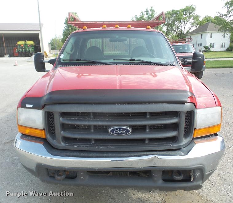 image for item DA6313 1999 Ford F350 Super Duty Crew Cab flatbed pickup truck