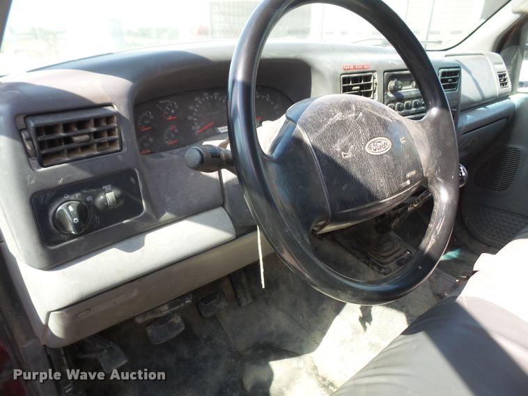 image for item DA6313 1999 Ford F350 Super Duty Crew Cab flatbed pickup truck