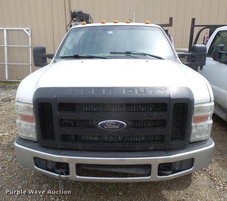 image for item DA8230 2008 Ford F350 Super Duty flatbed pickup truck with crane