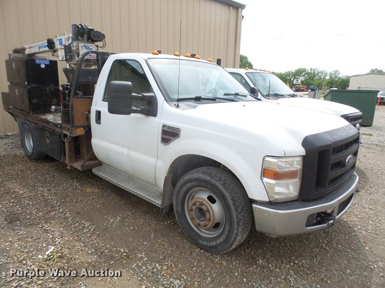 image for item DA8230 2008 Ford F350 Super Duty flatbed pickup truck with crane