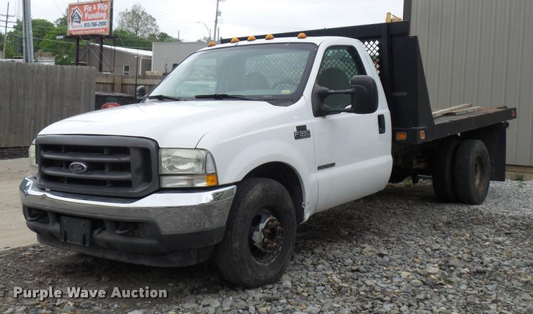 image for item DD9470 2003 Ford F350 flatbed pickup truck