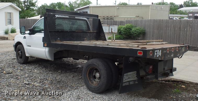image for item DD9470 2003 Ford F350 flatbed pickup truck