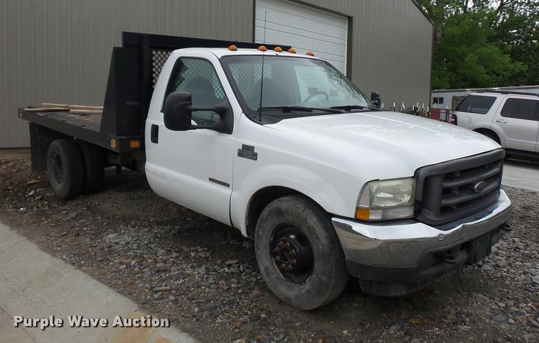 image for item DD9470 2003 Ford F350 flatbed pickup truck