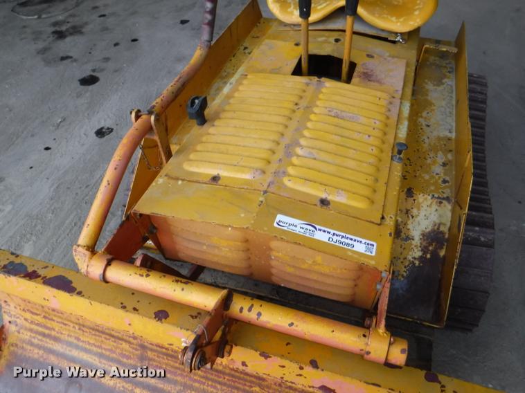 image for item DJ9089 1965 Strut Magnatrac mini dozer