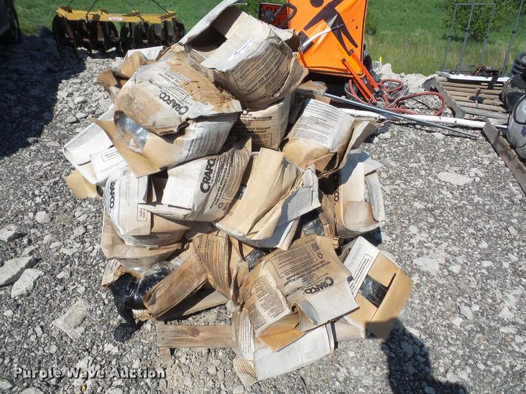 image for item DL9697 Approximately 50 boxes of Crafco Roadsaver 514 crack seal filler