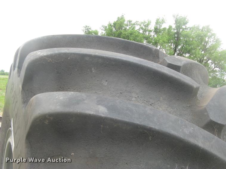 image for item AR9868 Firestone 73x44.00-32 floater tire and wheel