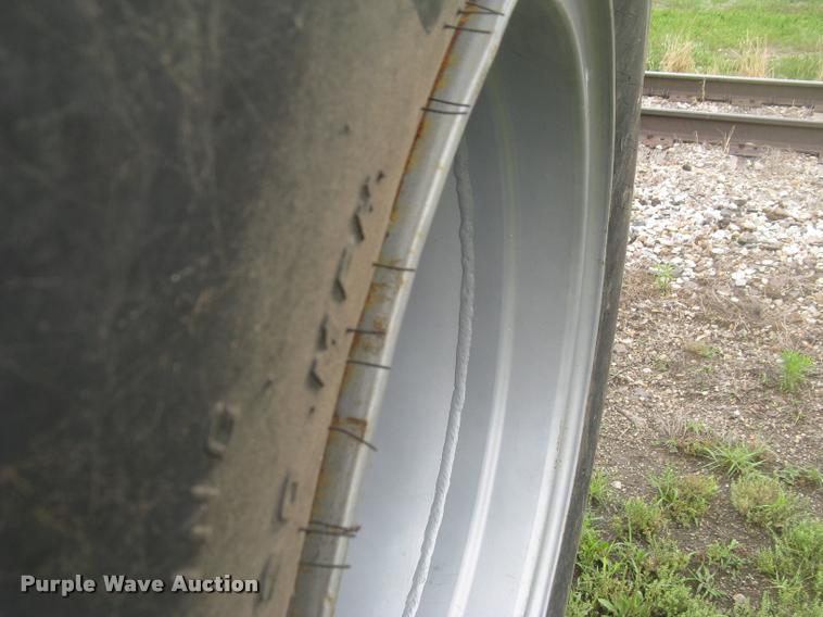 image for item AR9868 Firestone 73x44.00-32 floater tire and wheel