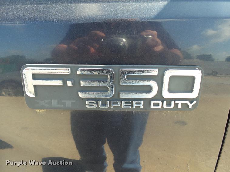 image for item DA2710 1999 Ford F350 Super Duty SuperCab utility bed pickup truck