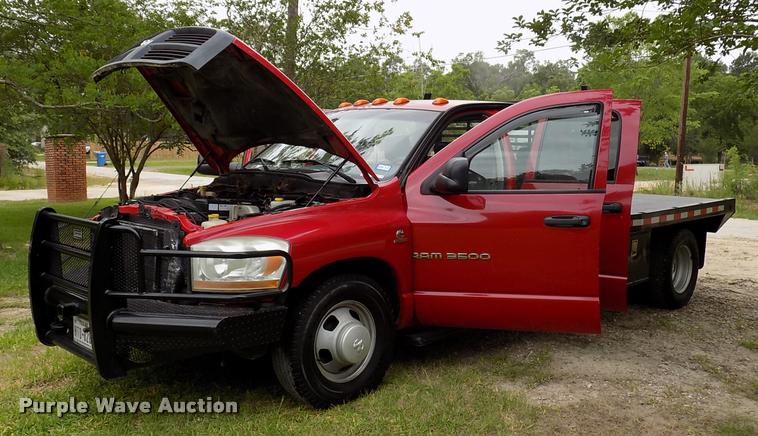 image for item DK9997 2006 Dodge Ram 3500 Quad Cab flatbed pickup truck