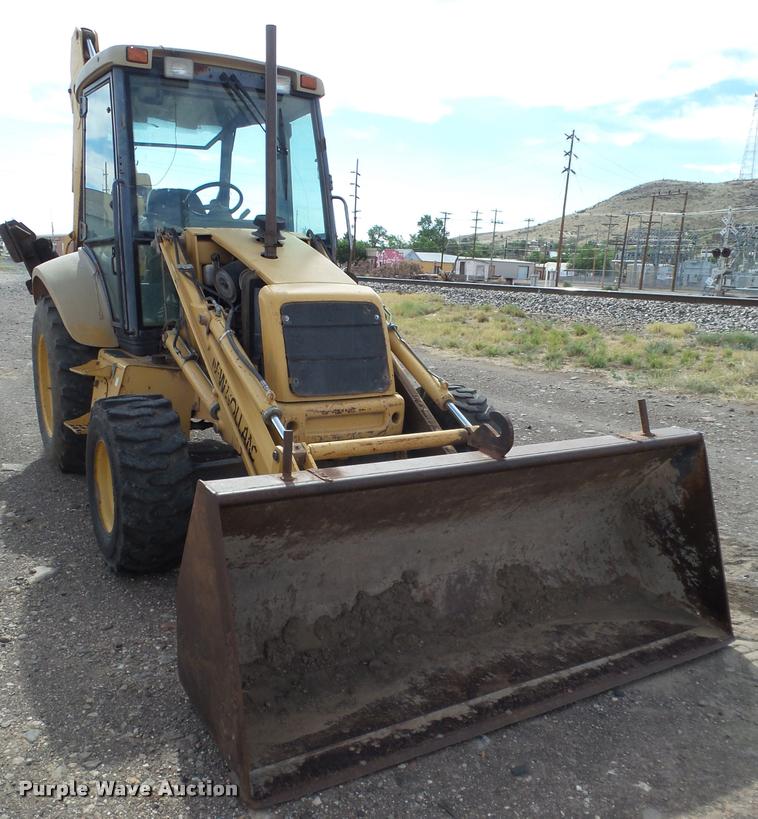 image for item L1519 Ford 555E backhoe