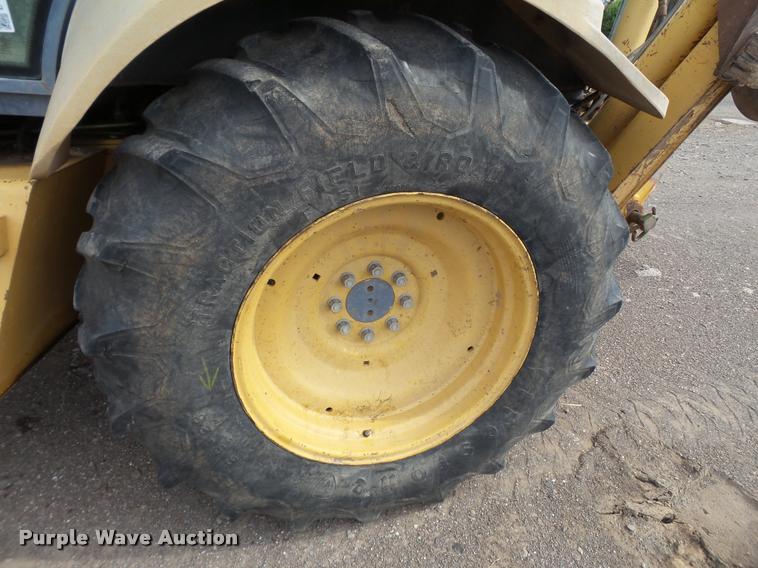 image for item L1519 Ford 555E backhoe