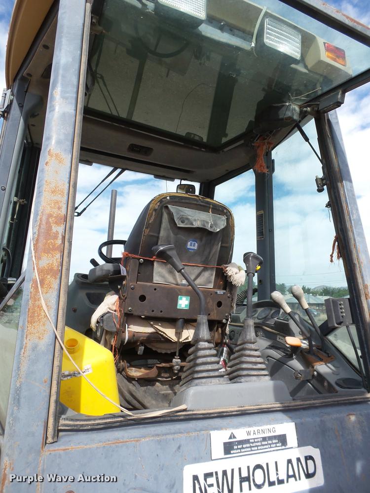 image for item L1519 Ford 555E backhoe