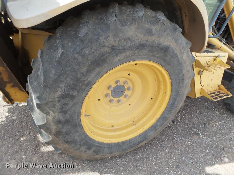 image for item L1519 Ford 555E backhoe